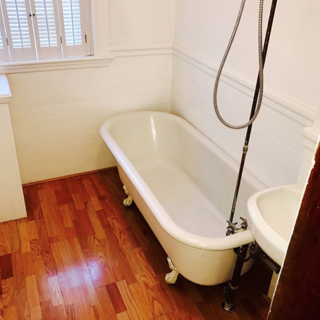 wooden clawfoot tub